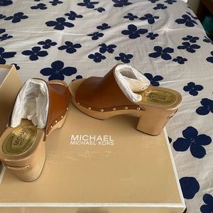 Michael Kors brown slip on shoes. Super cute and worn 1-2 times. Super cute